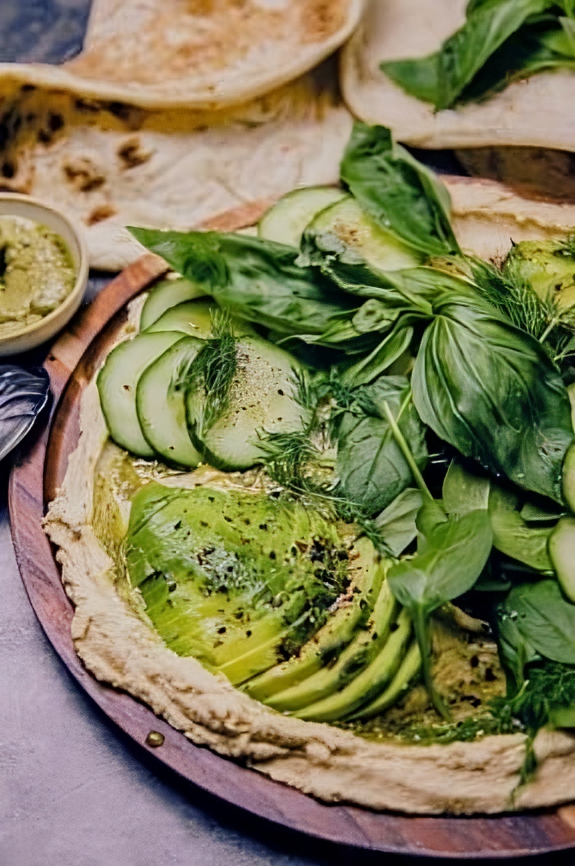 Lebanese hummus dish with avocado and herbs
